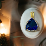 18K Gold Enhancer Pendant With a 21.30Ct Triangle Cut Natural Tanzanite