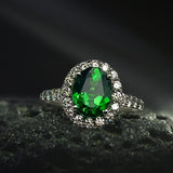 Platinum Ring With an Oval Tsavorite and White Round Diamonds