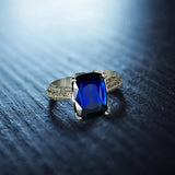 Platinum Ring With a Blue Sapphire and White Round Diamonds