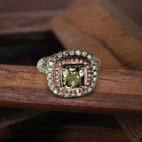 18K Gold Ring With a Cushion Cut Diamond and Natural Pink and White Diamonds