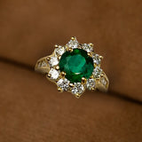 Custom 18K gold ring with 1.84 Ct. round emerald