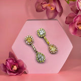 Diamond earrings featuring white, pink and vivid yellow diamonds