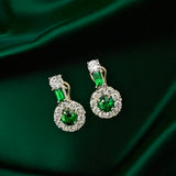 Platinum earrings with tsavorite gemstones and diamonds