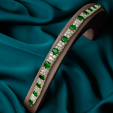 Yellow gold bracelet with oval shape emeralds and diamonds